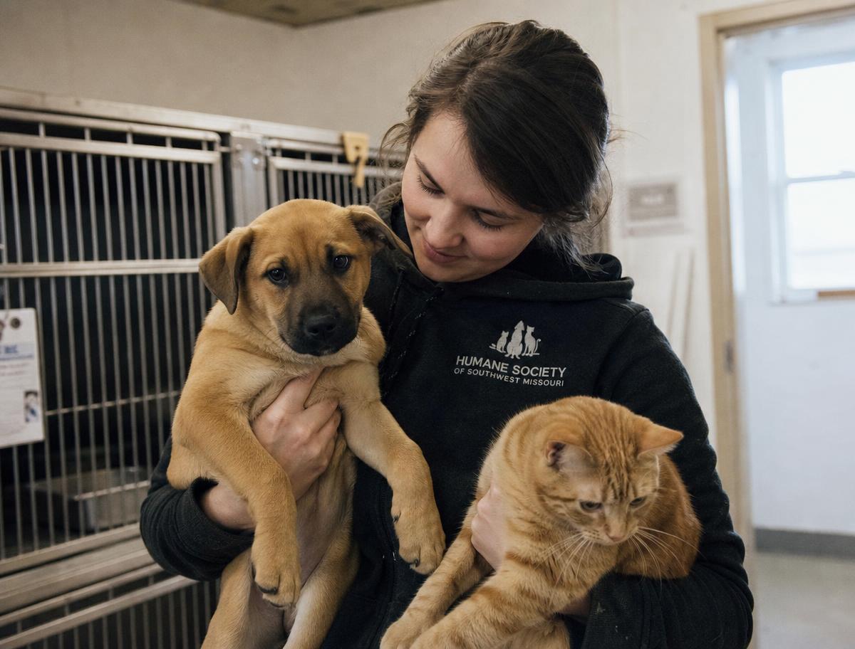 Man with rescued animals